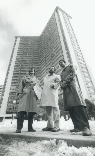 On Tour: Planners John Gladki, left, and Gary Wright, and tenant association's Desmond Christopher, right, check out deteriorating highrises during a recent tour of the development