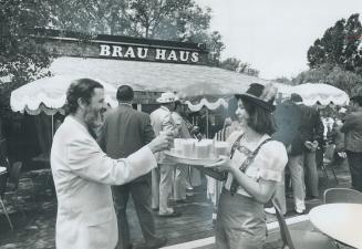 Debbie Ostler serves mandel sprachman at Brau Haus