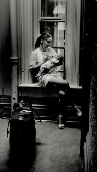 Robertson House resident Madonna feeding her 2-month-old daughter Jahradd hopes eventually to find an apartment of her own