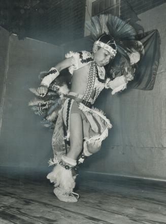 Celebrating, Indian style, 6-year-old Wally Manitowabi does a traditional Indian dance at the Indian pavilion of Caravan 71. He is from Manitoulin island