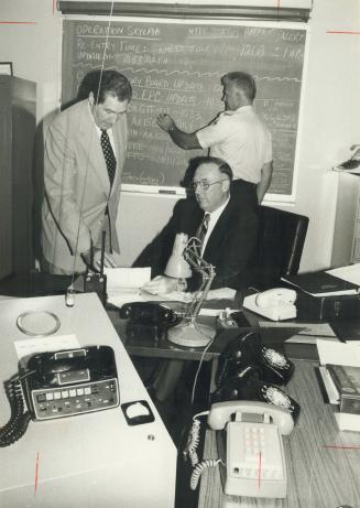 Inspectors Robert White (standing) and Dave Cowan on Metro Skylab watch