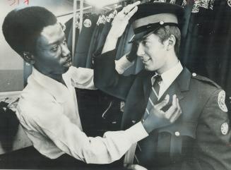 Being fitted for his uniform by tailor Joseph Yonge, Metro Police Constable Martin French said he couldn't see any real future as a policeman in Brita(...)