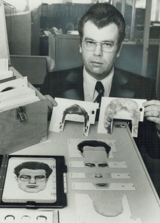 That's SGT. Guy Larwill holding parts of a kit for assembling photos of crime suspects--and that's Larwill in the composite photo on the table, assemb(...)