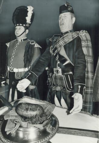 All hail haggis Warrant Officer George Walker of the 48th Highlanders recites traditional Ode to the Haggis at Robert Burns day celebration yesterday (...)