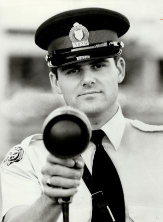 Constable Brick Briggs with new-style radar gun being used in Metro