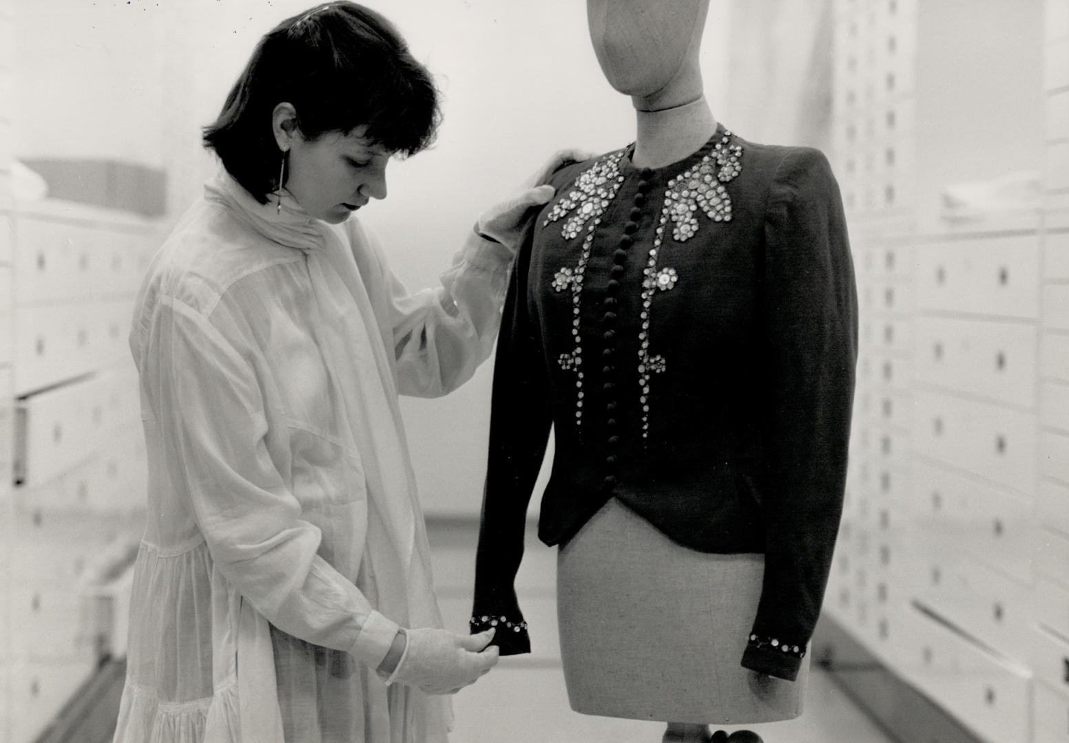 Decorative apparel: Alexandra Palmer of the ROM's textile department examines a Molyneux jacket