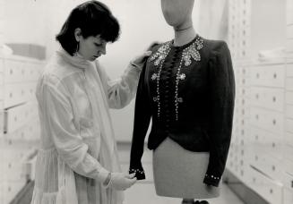 Decorative apparel: Alexandra Palmer of the ROM's textile department examines a Molyneux jacket