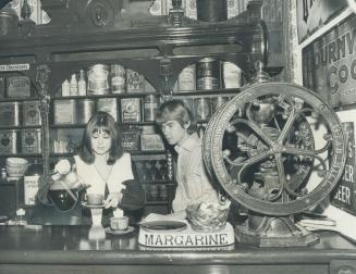 Surrounded with antiques, Joy and Neil Dixon preside at the counter of their coffee house, Grumbles, at 71 Jarvis St
