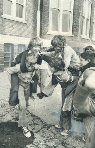Sharing a building, pupils in separate and public schools also horse around together on the playground