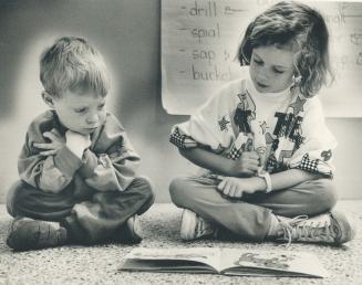 Book Buddies: Two students, one from kindergarten, the other Grade 2, are allowed to wander off together and read wahtever they want for up to 20 minutes
