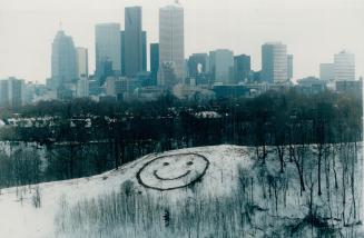 Putting on a happy face. While some moaned about the weekend snowfall, one enterprising person drew a happy face in the wet snow atop a hill on th wes(...)