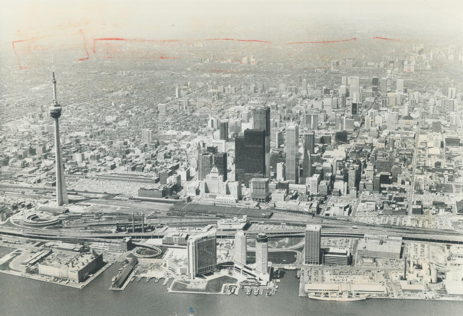 Image shows an aerial view of the Harbour buildings with CN Tower on the left.