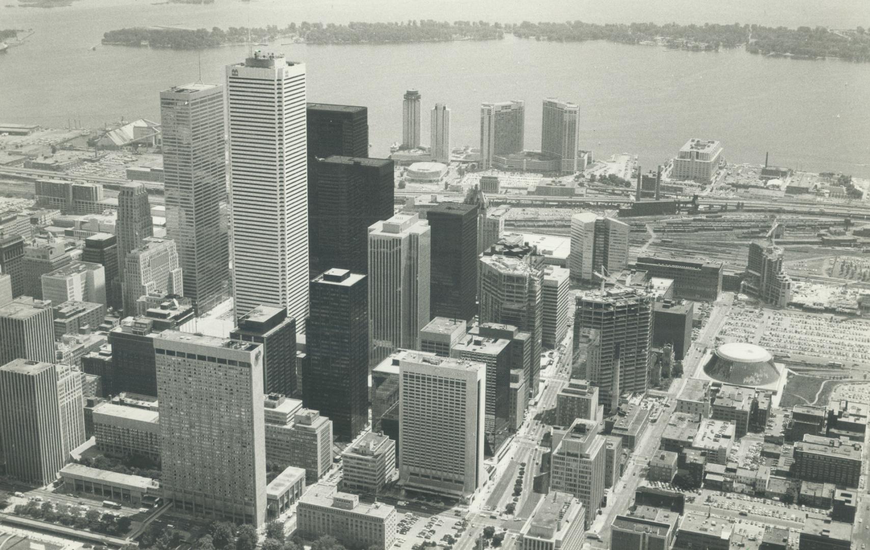 Image shows an aerial view of the Harbour buildings with the lake in the background.