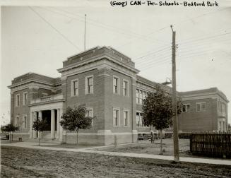 Original Toronto Star caption: Bedford park school. Image shows a two storey school with a few  ...