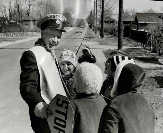 A Guard takes his farewell. William Ritchie, a crossing guard at Roselawn Ave. and Caldow Rd. for 15 years, says goodby to some of the children he's s(...)