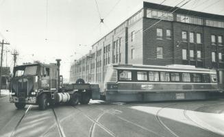 Streetcar holiday. Two new Toronto Transit streetcars have the yards at Bathurst St. and Davenport Rd. to be tested in Boston. The flat bed trucks carrying the cars were specially made for the job