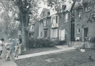 Solid looking, old fashioned houses line Rathnelly Ave