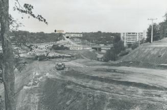 Extension of Wilson Ave., (foreground) leads to a new bridge over the Don River entering Hogg's Hollow and to Yonge St., crossing at right angles, wit(...)