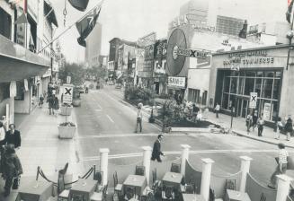 Yonge St. looking north from Gould is no longer a stretch of bumper-to-bumper traffic but a pedestrian-tempting garden of flowers, trees, outdoor tabl(...)