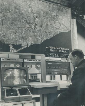 Operator George Stephenson at Metro's giant traffic computer