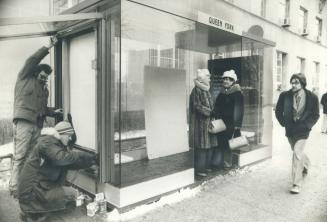 Bill Craig (kneeling), Marty Krbavcic install electrical system in shelter at Queen and York Sts
