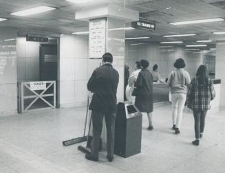 Historic photo from Thursday, May 23, 1968 - Bomb-blasted washroom in Eglinton subway station is placidly ignored by subway passengers in 1968 in Yonge and Eglinton