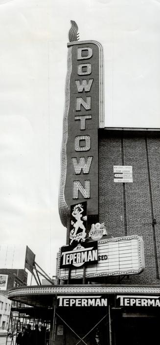 Marquee sign affixed to building reads, Downtown; smaller sign further down reads, Stripping --…