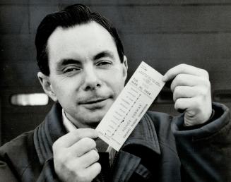 Transfer to the archives. John Richards is a man who likes to keep things, and here he holds up a TTC transfer issued on March 30, 1954 - the day Metro's first subway opened. Richards was 9 then
