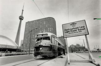 All systems go by the lake. A Red Rocket scoots along Queen's Quay toward Spadina Ave. yesterday, testing out the first new streetcar line to be opene(...)