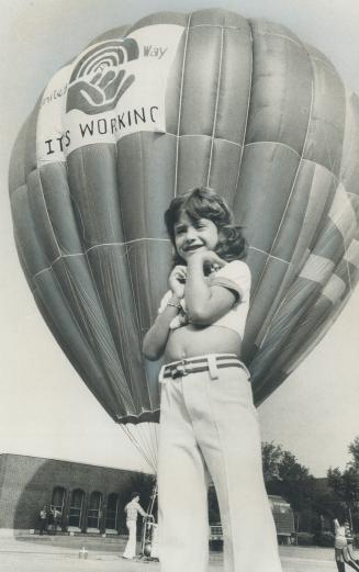 'It's my turn next . . .' Jillian Aimis, 7, waits her turn to go up in the United Way balloon, which is anchored in a Metro public works yard on Lesli(...)
