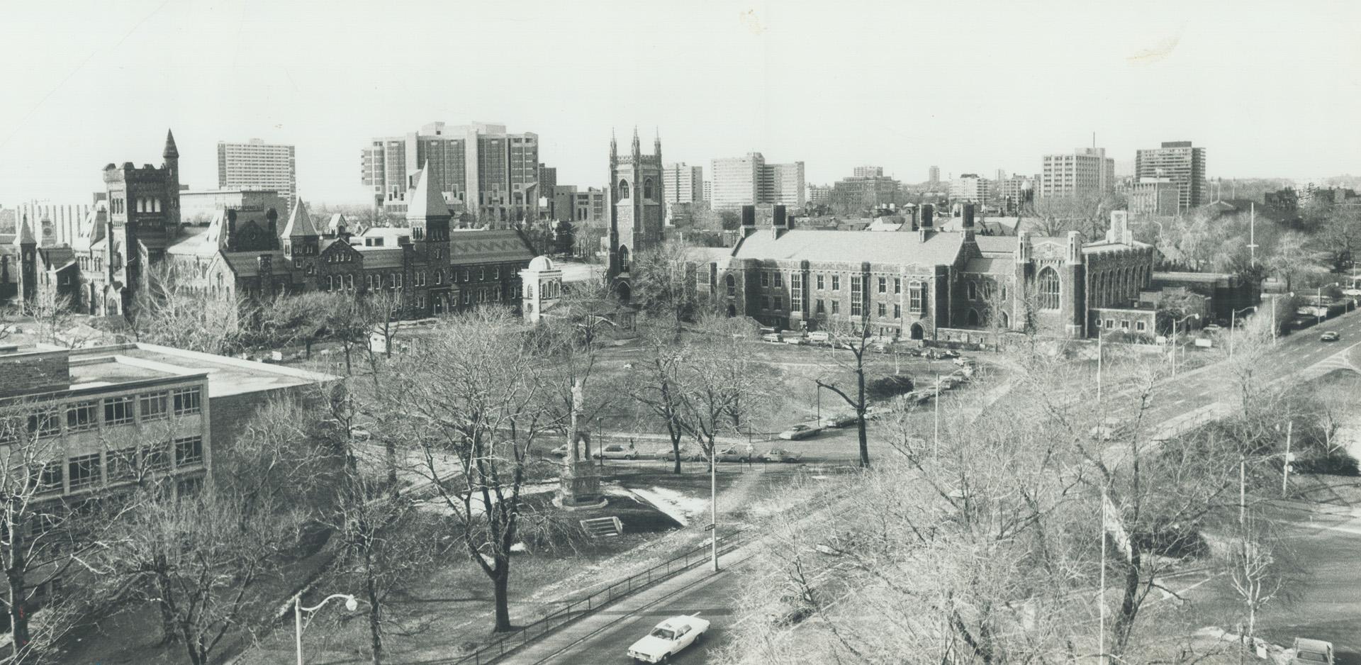 University College, left, and Har House on University of Toronto downtown campus, against backdrop of city high-rises