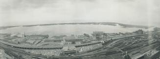 Image shows an aerial view of the Toronto Harbourfront and the lake.