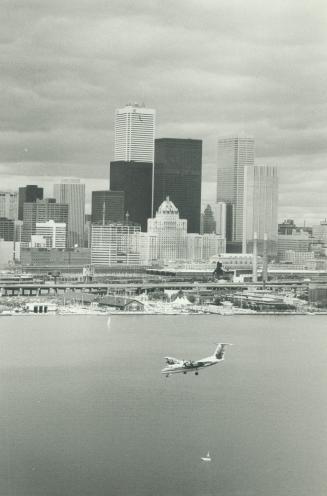 Image shows a lake view with Harbour buildings in the background.