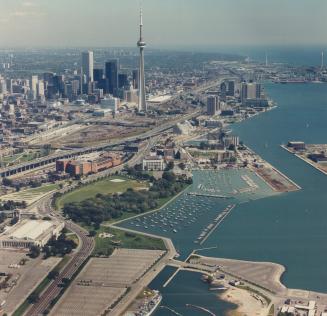 Image shows an aerial view of the waterfront with the CN Tower in the background.