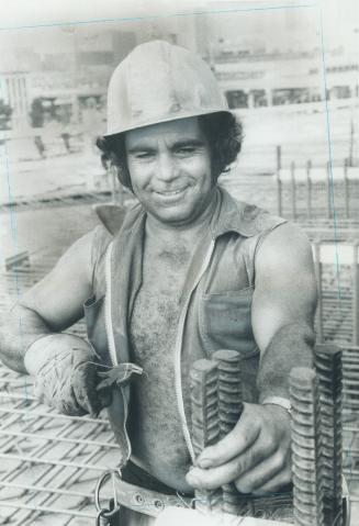 Image shows a construction worker on the site.