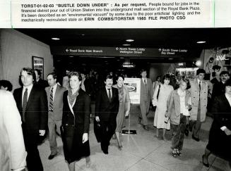 People bound for jobs in the financial district pour out of Union station into the underground mall section of the Royal Bank Plaza