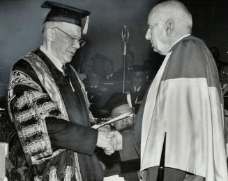C. M. Hincks (right) receives doctor of laws degree Dr. F. C. A. Jeannerest, U. of T. chancellor, confers honorary degree