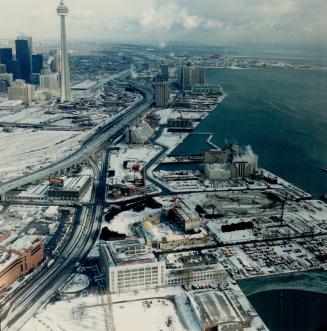 Image shows an aerial view of the waterfront with the CN Tower on the left.