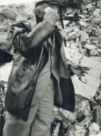 Risto Radovich, 74 Croying on the ruins of his leveled home in village of Sutonichi