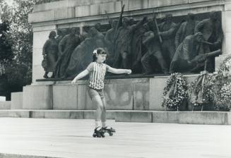 Work and play go hand in hand in the parks of Sofia where this little skater has a backdrop of anti-Fascists struggle