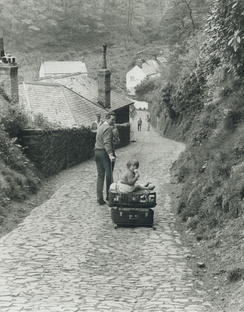 Sledding without snow is popular with the young fry of Clovelly, Devon