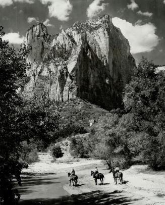 The twin peaks of Sentinel Mountain in Zion Park in southern Utah look down on a peaceful valley