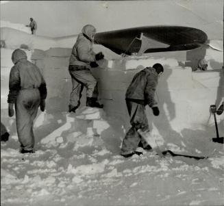 A Work Party builds a hangar for the expedition's cabin plane