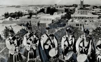 Pipes and Drums welcome visitors to Fort Hamilton overlooking Bermuda's capital city of the same name
