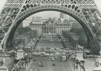 The awe-inspiring size of the Eiffel Tower comes across in this photo taken from across the Scine with the Ecole Militaire in background