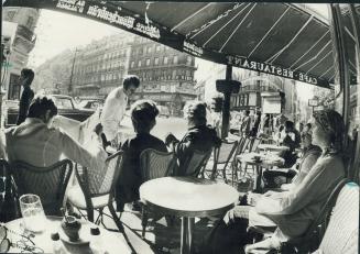 What better spot can there be for viewing the passing parade than one of the countless sidewalk cfes that dot the street of Paris?