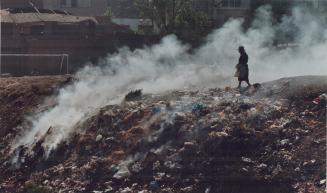 Peru - garbage dump along the banks of Riu Rimac, the river running through Lima