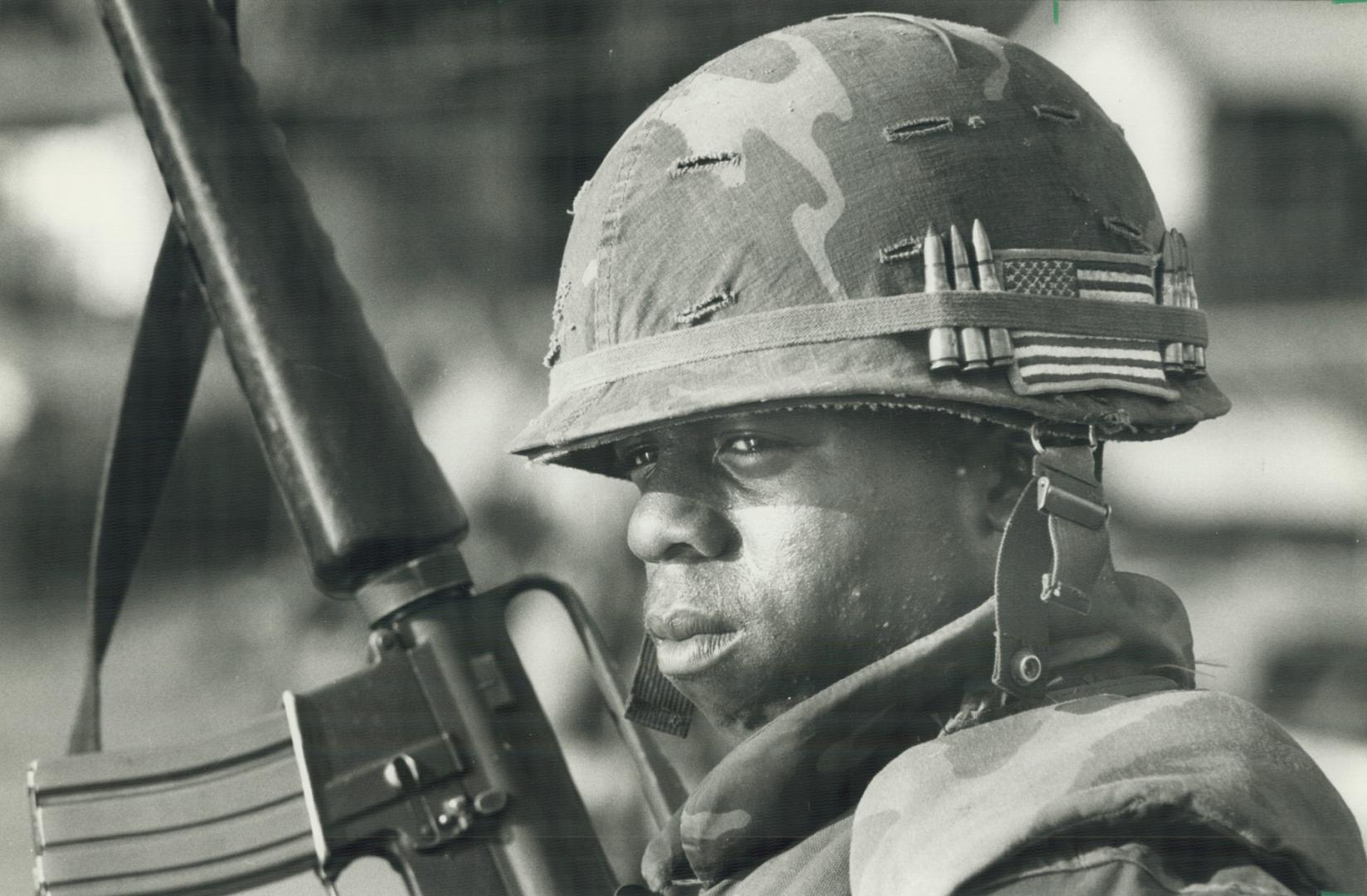 Grenada Guard, A U.S. Marine stands guard at one of the main bridges on the road leading to St. George's during the American invasion of Grenada