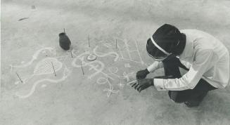 Haitian voodoo priest draws circles in the dirt, preparing a 'no fear' spell for Ben Wicks