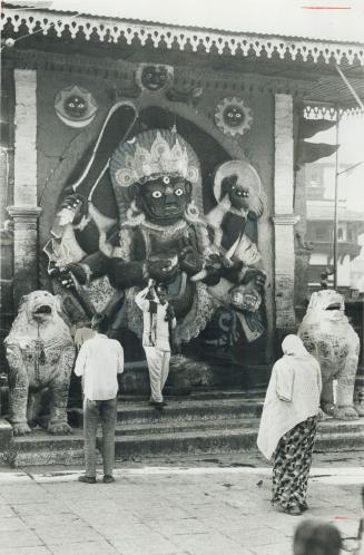 Outdoor statue of the Hindu goddess Kali attracs the curious as well as the devout